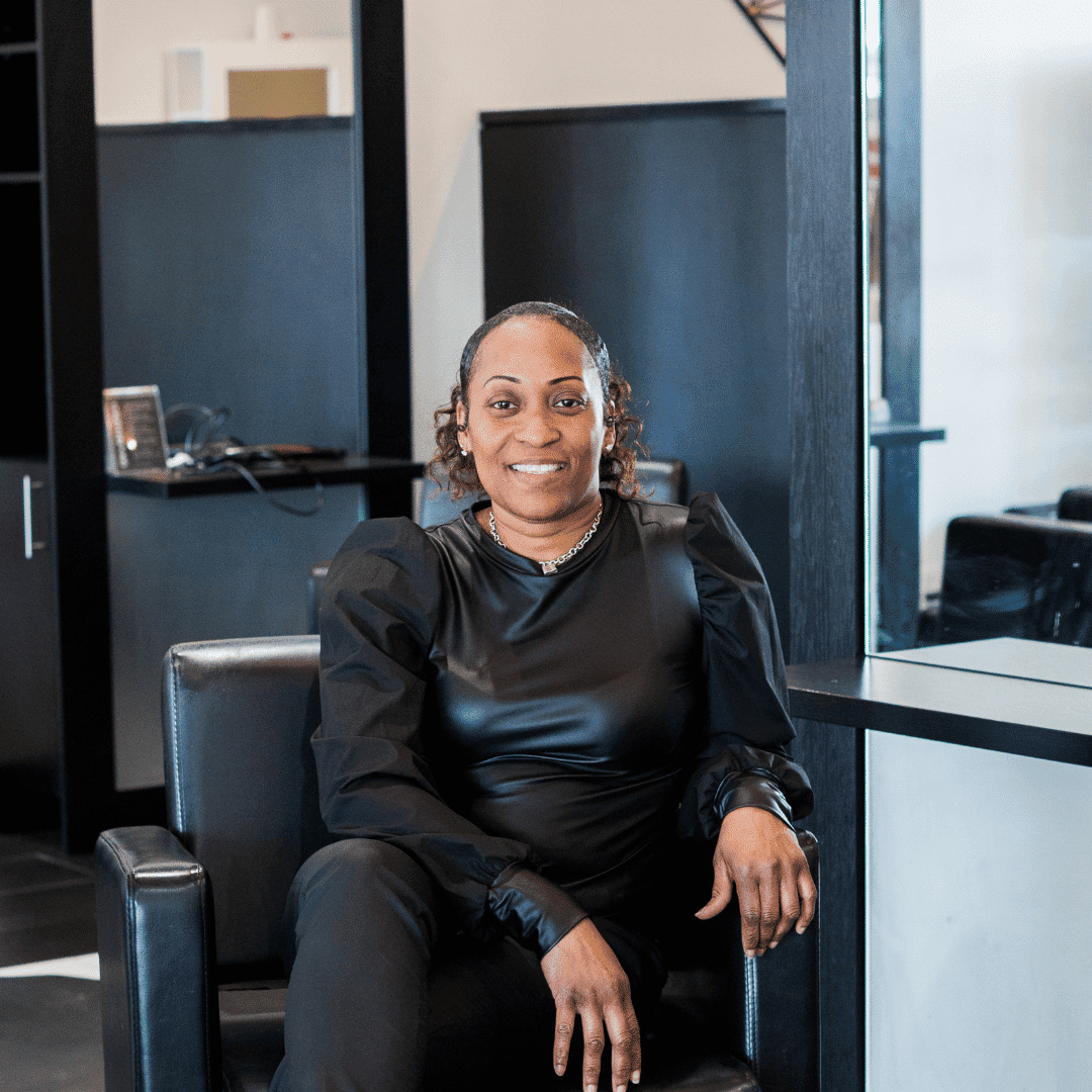 Portrait of Nakita, a professional stylist at Escape Blowdry Bar and Salon, showcasing their expertise and style.